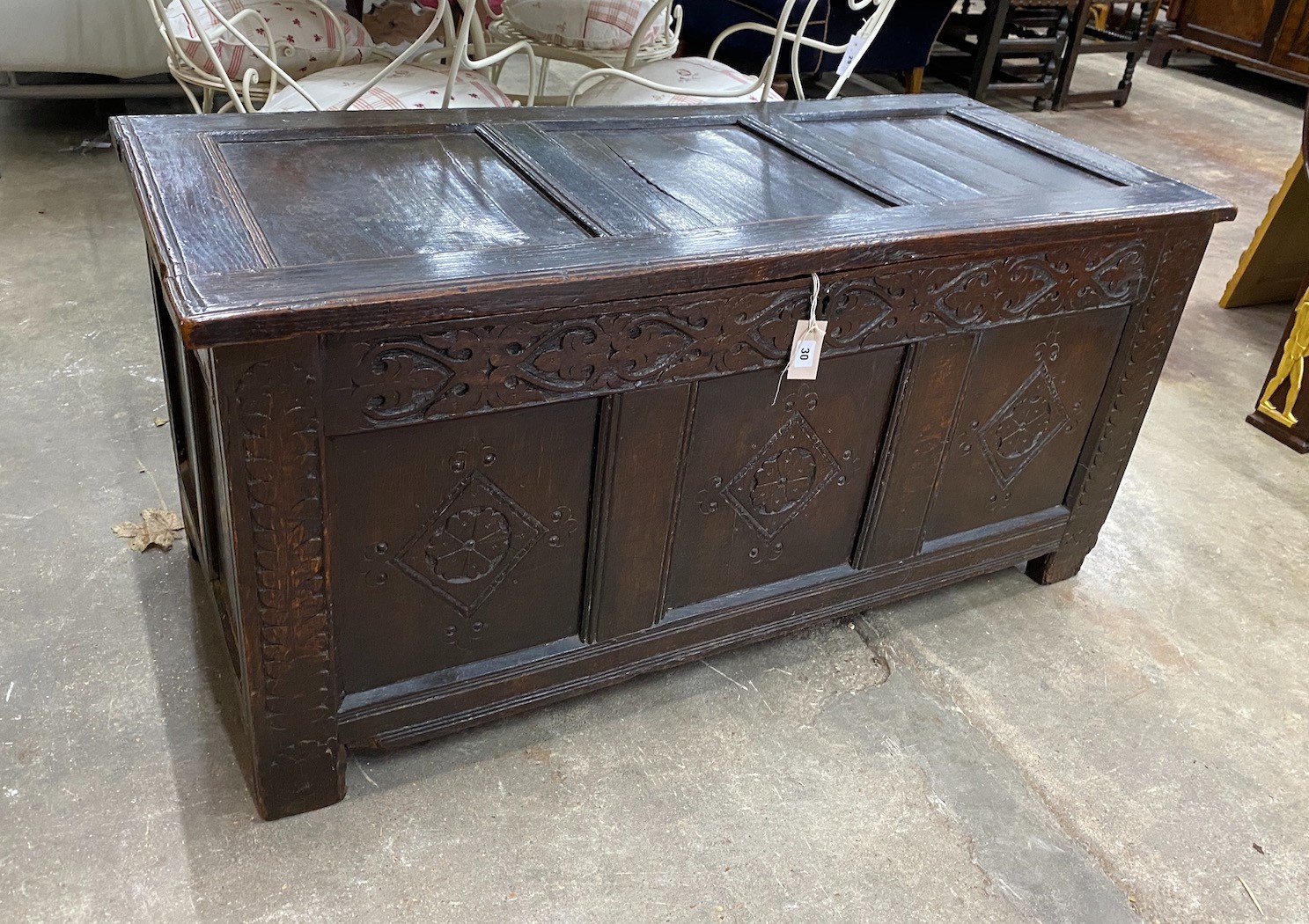 An 18th century carved oak coffer, length 134cm, depth 58cm, height 65cm